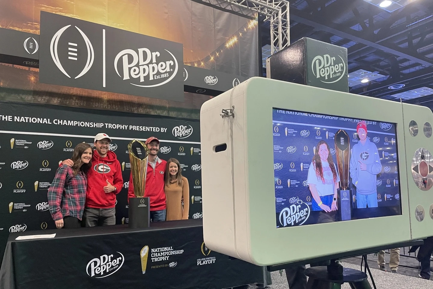 Fans Getting Live Event Photography with the College Football Championship Trophy Presented by Dr Pepper